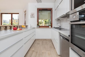Apartment, 2 Bedrooms, Balcony | Private kitchen | Microwave, highchair - Family Apartment Kopernika by Renters (Gdynia)