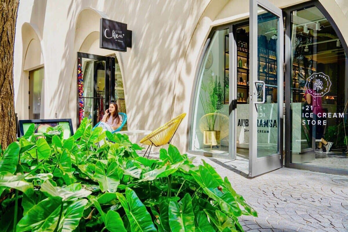 A storefront with a sign reading "Chic" and a glass door entrance.