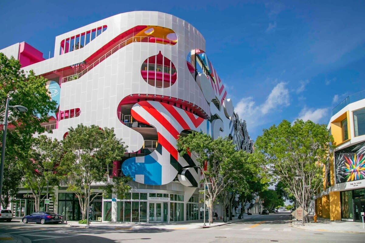A modern building with a unique, curved architecture and large windows.