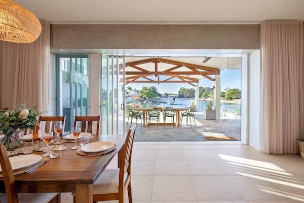 The home features stacking doors for an indoor, outdoor flow