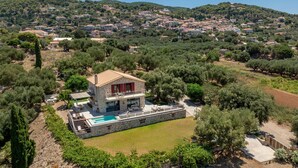 A stone villa with a pool, surrounded by olive trees and a hillside village. - Arca Villa - Enchanting Sunset! (Zakynthos)