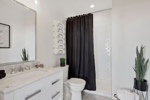 Bathtub, hair dryer, towels, soap