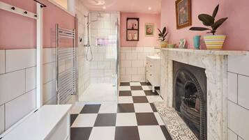 Shower, hair dryer, towels, shampoo