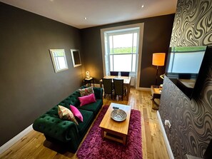 Comfort Apartment | Living area | 50-inch Smart TV with digital channels