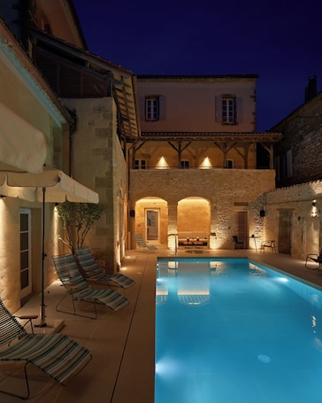 Seasonal outdoor pool, open 9:00 AM to 8:00 PM, pool umbrellas. Hotel Le Chevalier Bleu