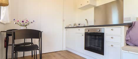 Fridge, electric kettle, cookware/dishes/utensils