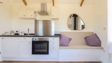 Fridge, electric kettle, cookware/dishes/utensils