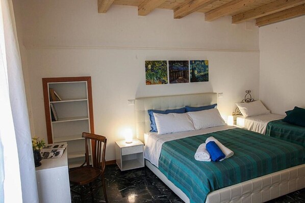 1 bedroom, desk, iron/ironing board, travel crib