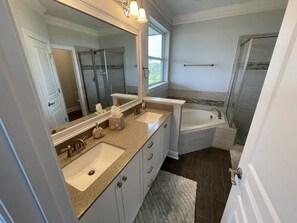 Shower, hair dryer, towels, toilet paper