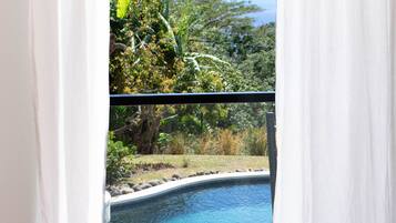 Premium bedding, desk, laptop workspace, iron/ironing board