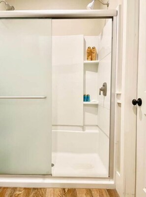 Shower, hair dryer, soap, toilet paper