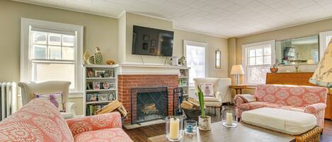 TV, fireplace, books