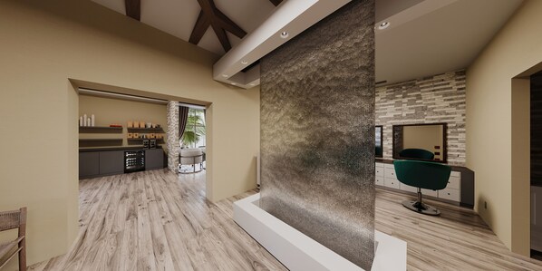 A modern interior with a kitchen, dining area, and a bathroom with a stone wall.