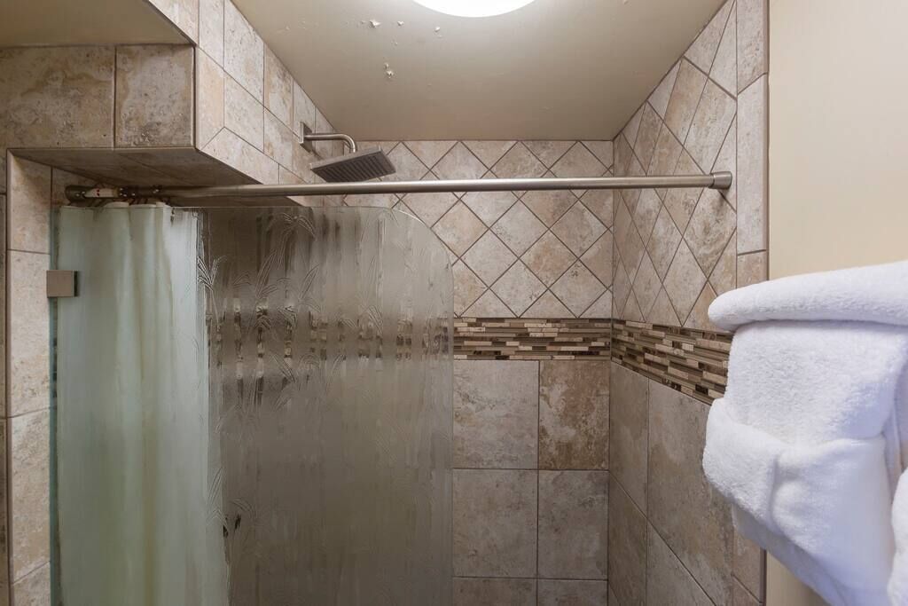 Bathtub, eco-friendly toiletries, hair dryer, towels