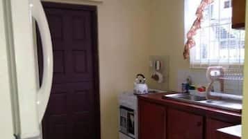 Fridge, oven, electric kettle, cookware/dishes/utensils