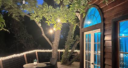 Cozy Treehouse on Lake Conroe w/ large nest deck with a creek view