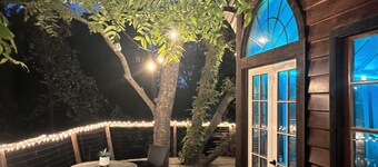 Cozy Treehouse on Lake Conroe w/ large nest deck with a creek view