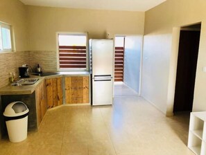 Fridge, microwave, stovetop, cookware/dishes/utensils
