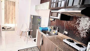 Fridge, microwave, electric kettle, cookware/dishes/utensils