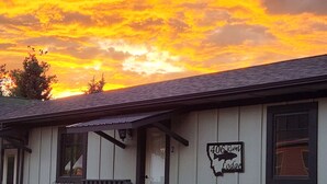 A building with a sign reading "406 River Lodge." - On the banks of the Yellowstone River, 3 blocks from the North Entrance of YNP (Gardiner)