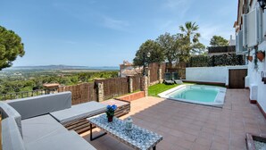 A patio with a pool, outdoor furniture, and a view of the landscape. - VERDI: House with spectacular sea views and private pool in Pals (Pals)