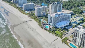 A coastal hotel with multiple high-rise buildings, a beach, and a swimming pool. - Ocean view 3 BR/3BA condo!  Royale Palms 12th floor! Perfect for families! (Myrtle Beach)