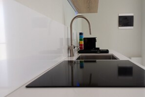 Fridge, microwave, stovetop, coffee/tea maker