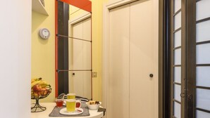 A bathroom with a white sink, mirror, and a towel rack.