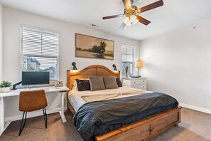 A bedroom with a bed, desk, chair, and a ceiling fan. - Spacious 2-Story, Pet&Fam Friendly, WFH, Gym&Pool (Draper)