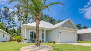 A single-story house with a white exterior, a covered front porch, and a well-maintained lawn. - Bright Foley Home w/ Patio - 7 Mi to Wharf & Beach (Foley)