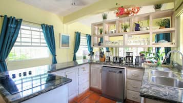 Fridge, stovetop, dishwasher, coffee/tea maker