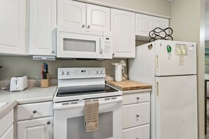 Coffee/tea maker, fridge, microwave, oven