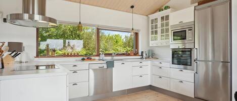 Fridge, stovetop, dishwasher, coffee/tea maker