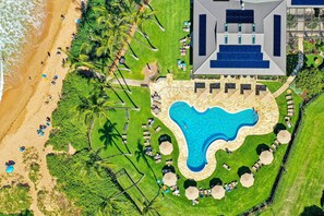 Relax by the central pool surrounded by sun loungers and umbrellas, or enjoy the beach with its soft sand and calm waters.
