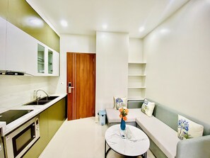 Luxury Apartment, 1 King Bed | Living area | 40-inch Smart TV with cable channels, TV - Sakura Apartment (Hai Phong)