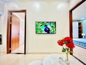 Family Apartment | Living area | 40-inch Smart TV with cable channels, TV - Sakura Apartment (Hai Phong)