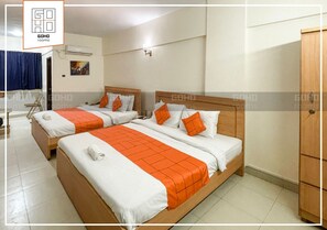 Deluxe Quadruple Room | Soundproofing - GOHO ROOMS 10th Commercial (Karachi)