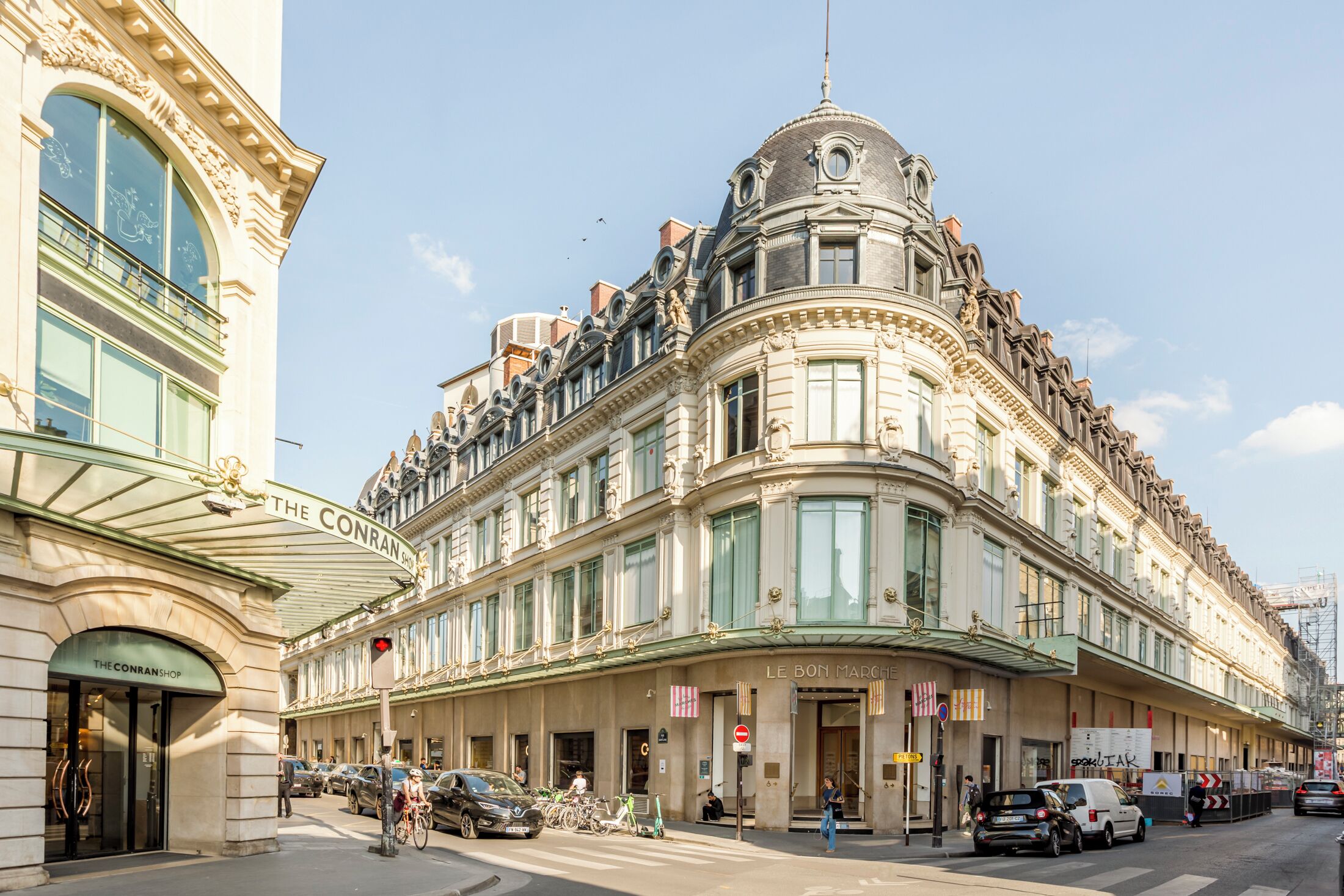 A historic building with ornate architecture, including a curved facade and a prominent dome.