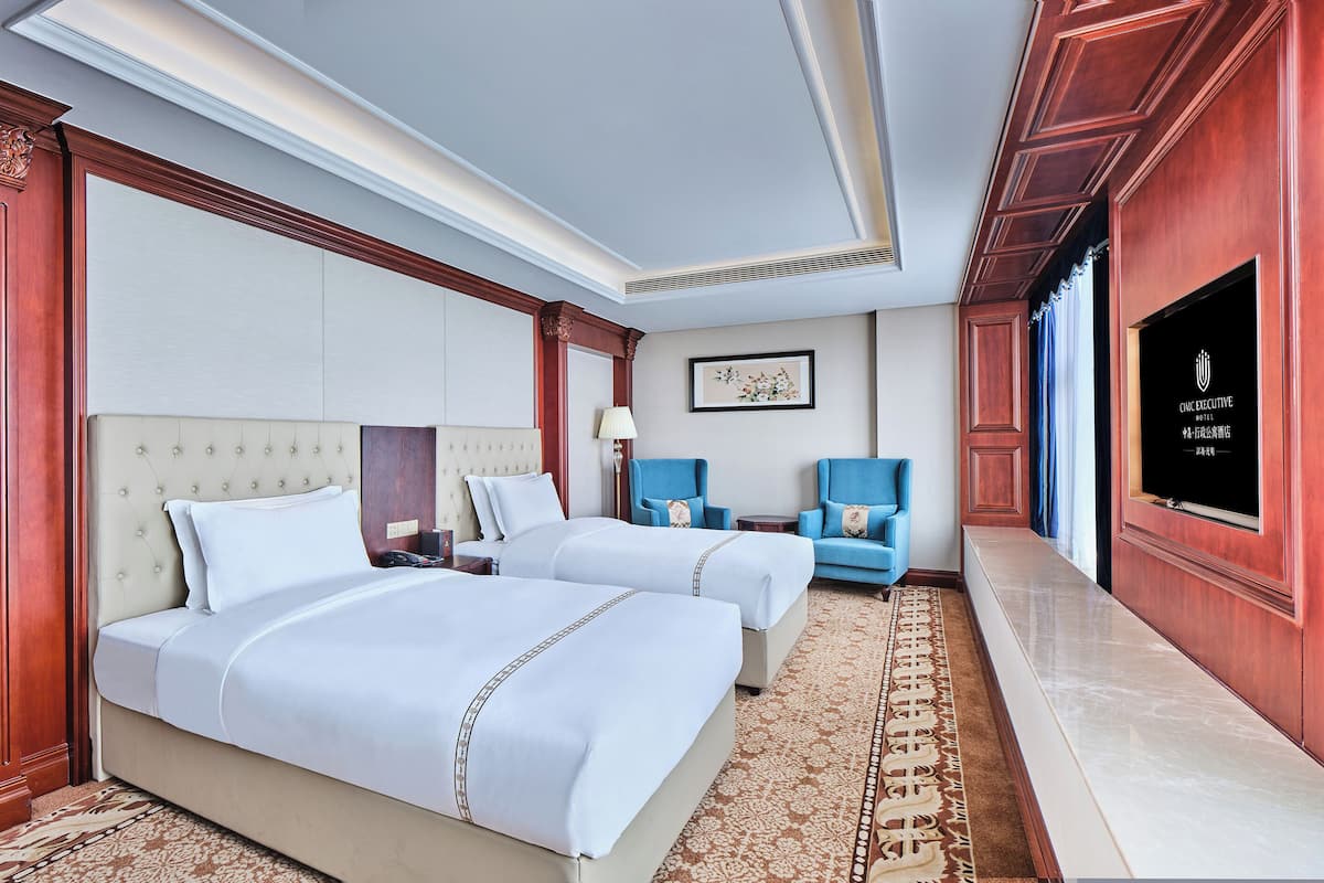 ห้องเอ็กเซกคิวทีฟ | เครื่องนอนระดับพรีเมียม, เตียงพร้อมฟูกเสริมที่นอน, ตู้นิรภัยในห้องพัก