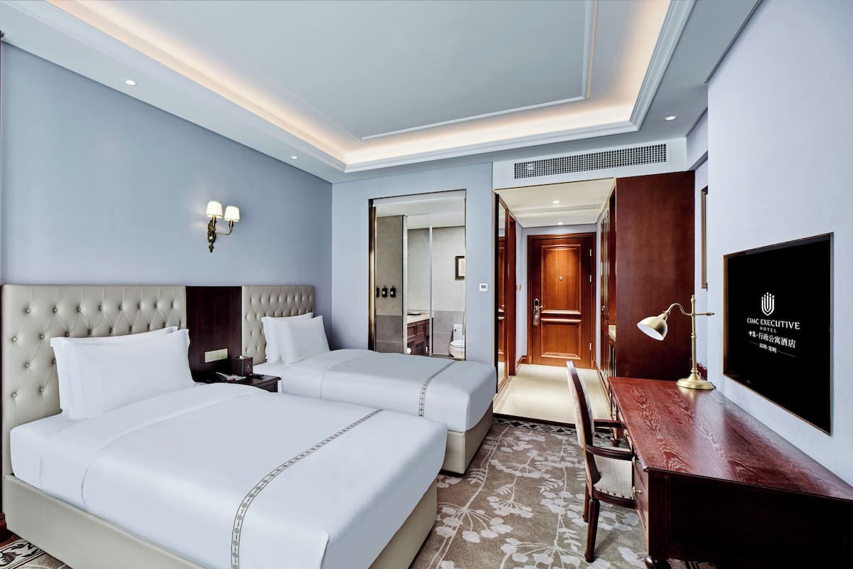 ห้องดีลักซ์ | เครื่องนอนระดับพรีเมียม, เตียงพร้อมฟูกเสริมที่นอน, ตู้นิรภัยในห้องพัก