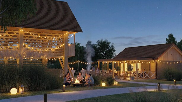 A cozy outdoor seating area with a fire pit, surrounded by string lights and wooden structures. - Resort Village Majer - Apartments, Glamping - Slovenia (Gradac)
