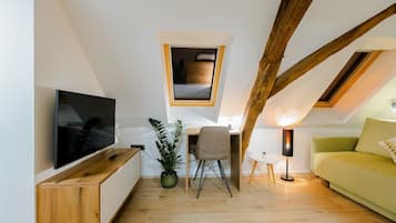 Premium Suite, 1 Bedroom, Courtyard Area | Living area | LCD TV, heated floors