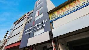Hotel Mauryan Elite with a prominent signboard, contact number, and a visible storefront with a sign for Balaji. - Mauryan Elite Hotel @ Devli Khanpur (New Delhi)