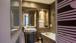 A bathroom with a sink, mirror, shower, and toilet. - When heritage, art and well-being meet (CANDES SAINT MARTIN)