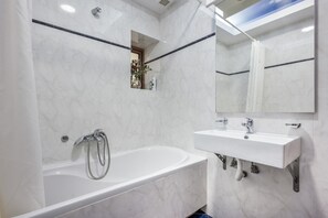 Bathtub, hair dryer, towels