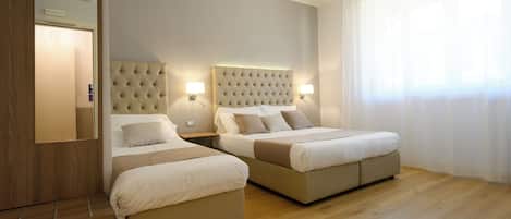 Family Triple Room | In-room safe, desk, laptop workspace, soundproofing
