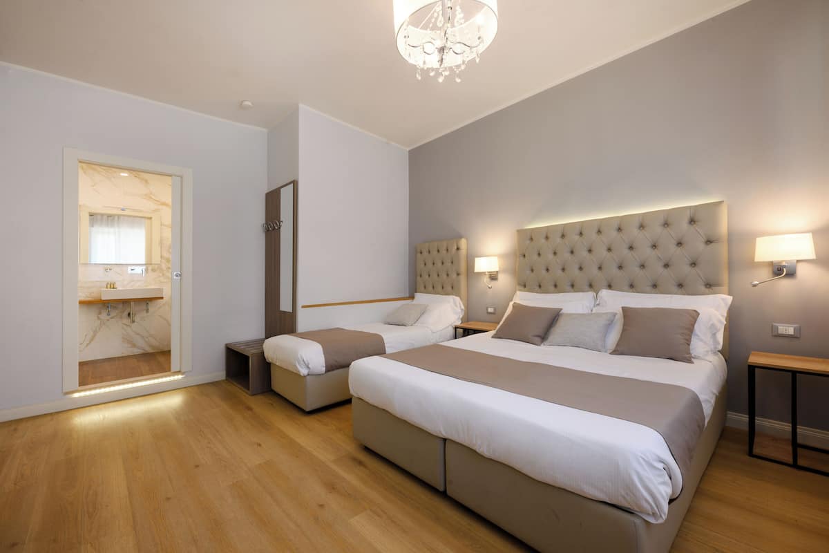 Family Triple Room | In-room safe, desk, laptop workspace, soundproofing