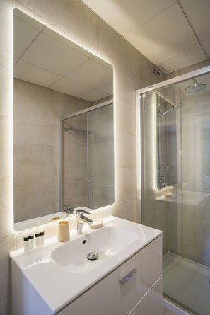 Shower, hair dryer, towels, soap