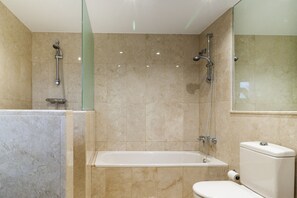 Bathtub, hair dryer, towels, soap