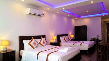 Premium Quadruple Room, 1 Bedroom, City View | Minibar, desk, laptop workspace, blackout curtains